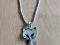 Collier chat aux yeux noir