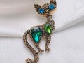 Joli broche chat d'orée yeux bleu