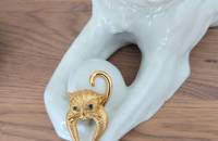 Broche chat aux yeux verts